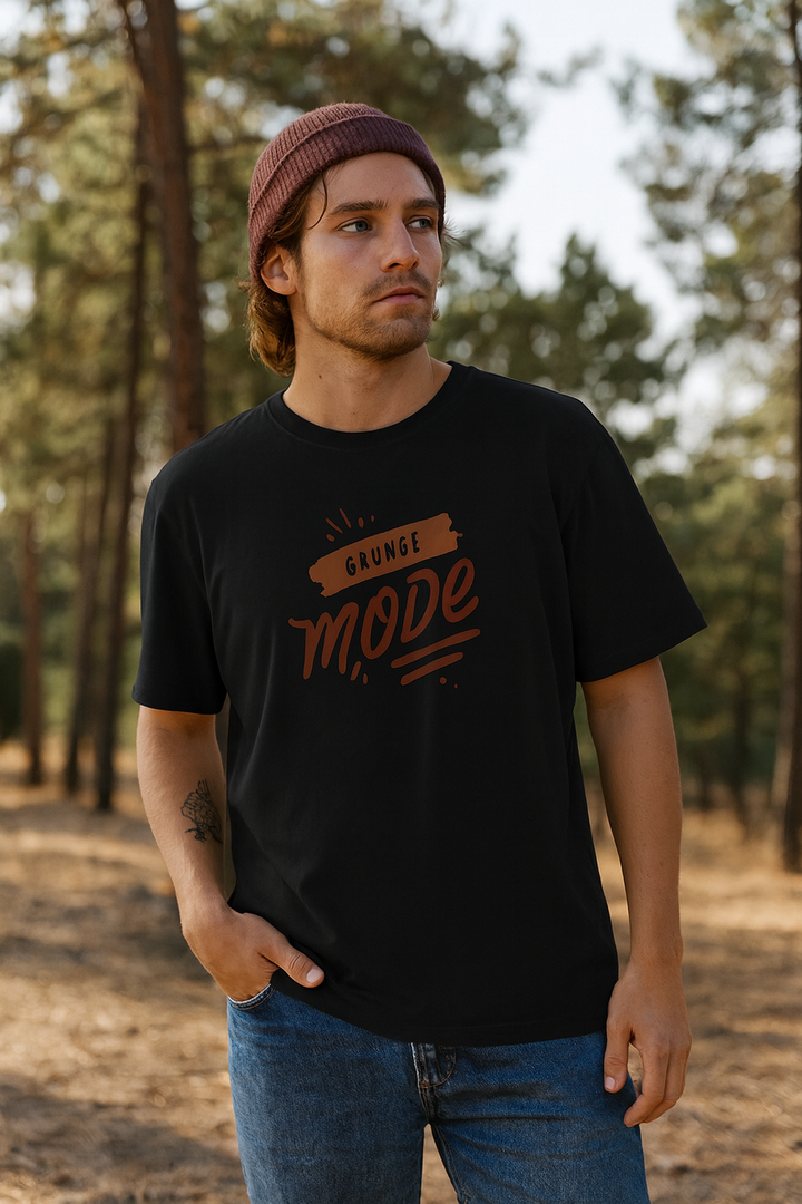 Person wearing a black t-shirt with 'Guns N' Roses' logo in a forest setting