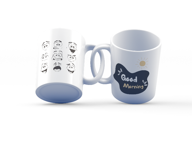 A set of two ceramic mugs, one with various playful cartoon faces and the other with a 'Good Morning' message accompanied by a sun illustration.