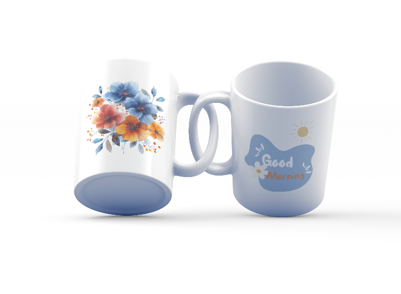 Two ceramic mugs, one with a 'Good Morning' message and a sun design, and the other featuring a floral arrangement of blue and orange flowers.