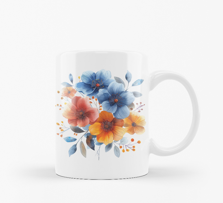 Two ceramic mugs, one with a 'Good Morning' message and a sun design, and the other featuring a floral arrangement of blue and orange flowers.
