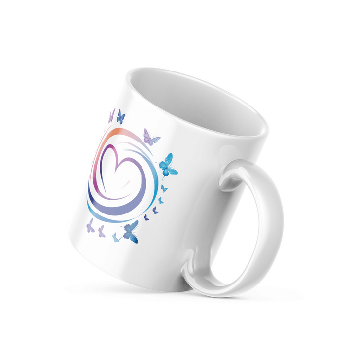 Two ceramic mugs, one with a colorful heart and butterflies design, and the other with a 'Good Morning' message with butterfly accents.