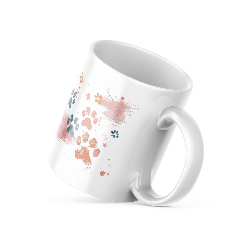 A set of two ceramic mugs, one with a splash of colorful paw prints and the other with a 'Good Morning' message in soft pink, both with animal-themed designs.