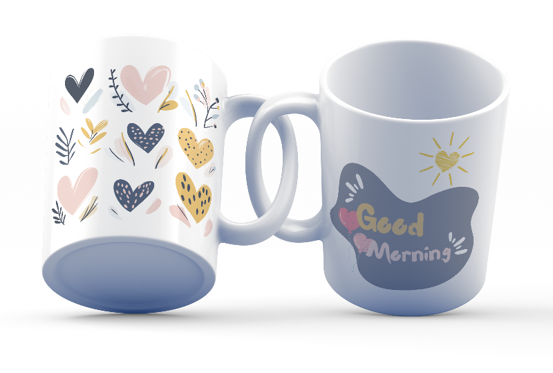 Two ceramic coffee mugs with heart and balloon patterns, one with a 'Good Morning' message and the other with a 'Good Night' message.