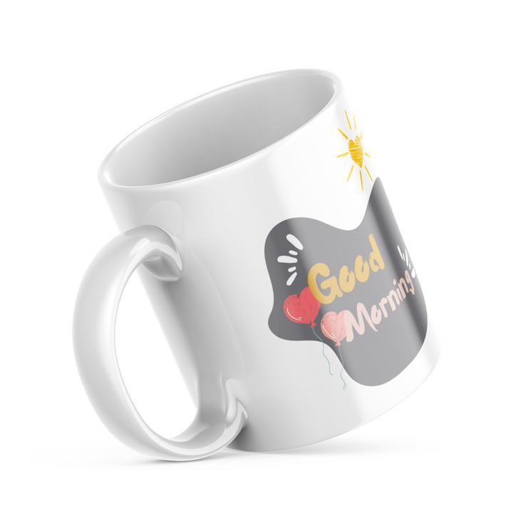 Two ceramic coffee mugs with heart and balloon patterns, one with a 'Good Morning' message and the other with a 'Good Night' message.