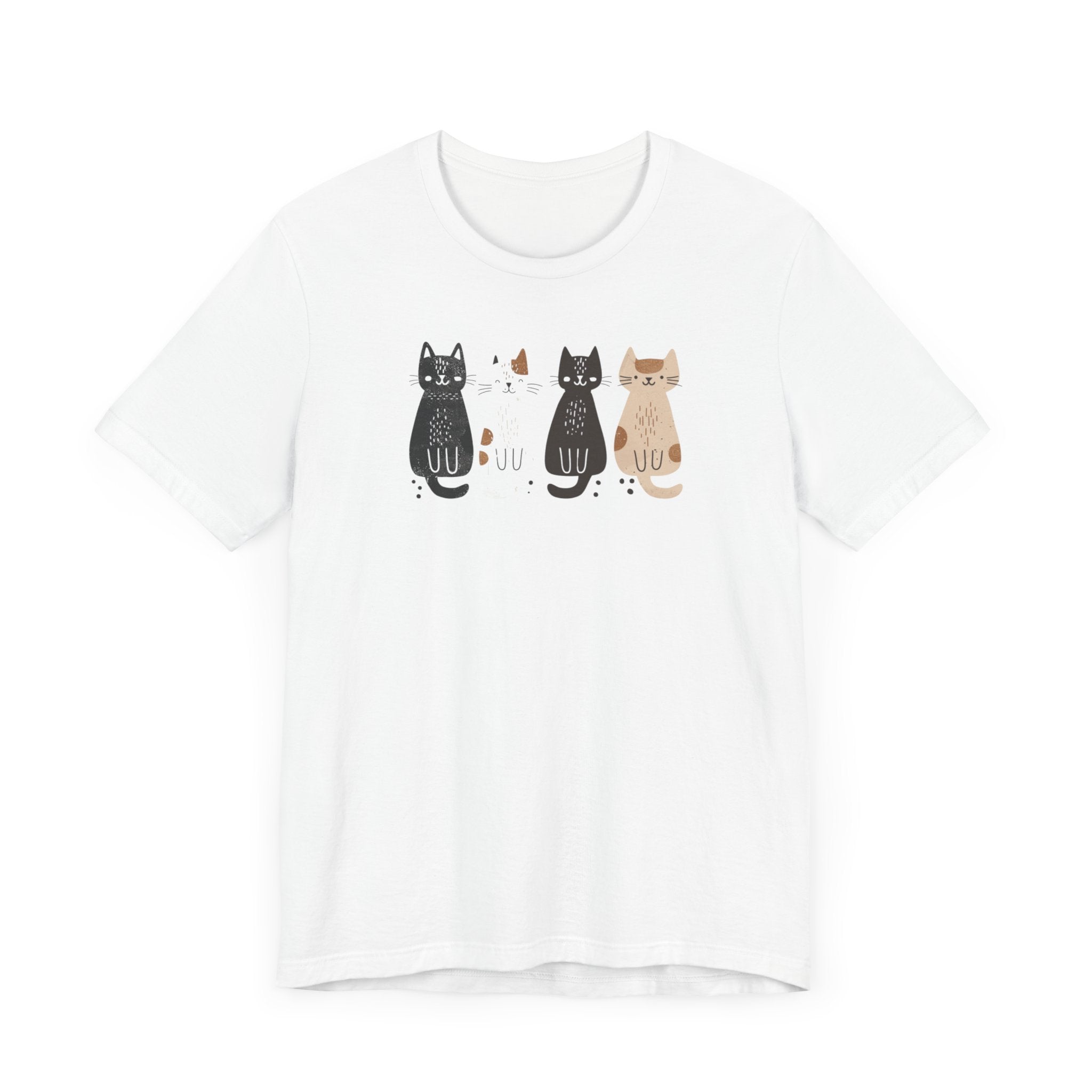 A white t-shirt featuring a graphic design of four cute cats in a lineup, each in different colors such as black, white, brown, and tan.