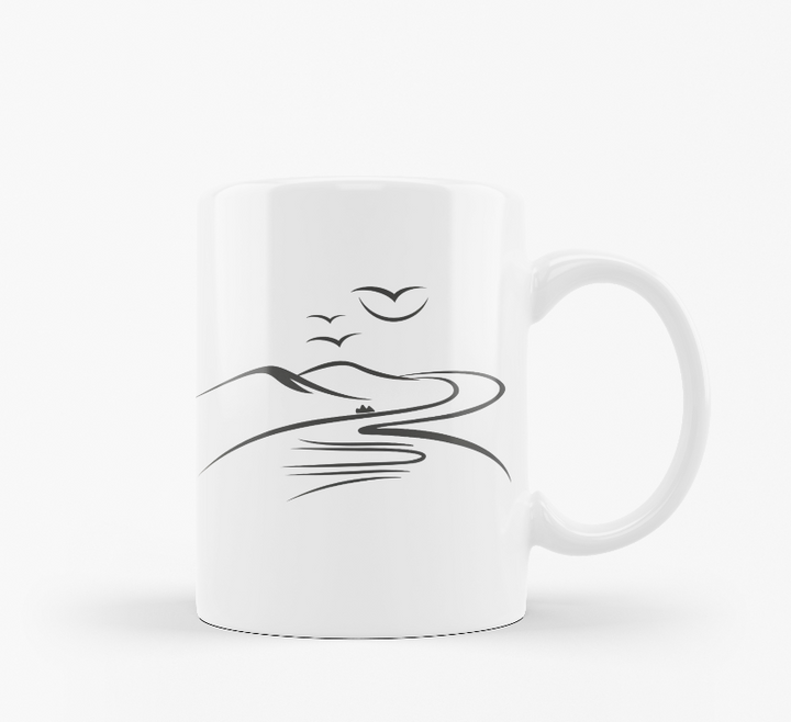 Two ceramic mugs side by side, one with a mountain design and the other with a sunrise and sunburst design, both featuring text 'Good Morning'.