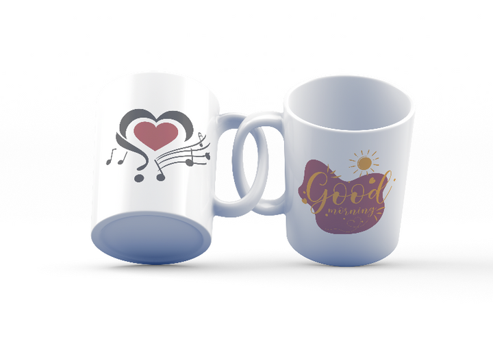 Two ceramic mugs, one with a heart and flowing music notes design in red, black, and gold, and the other with a 'Good Morning' message in the same color palette.