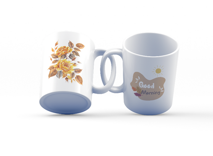 A set of two ceramic mugs, one with a floral design of golden roses and autumn leaves, and the other with a sun and leaves pattern, both with 'Good Morning' and 'Good Afternoon' text respectively.