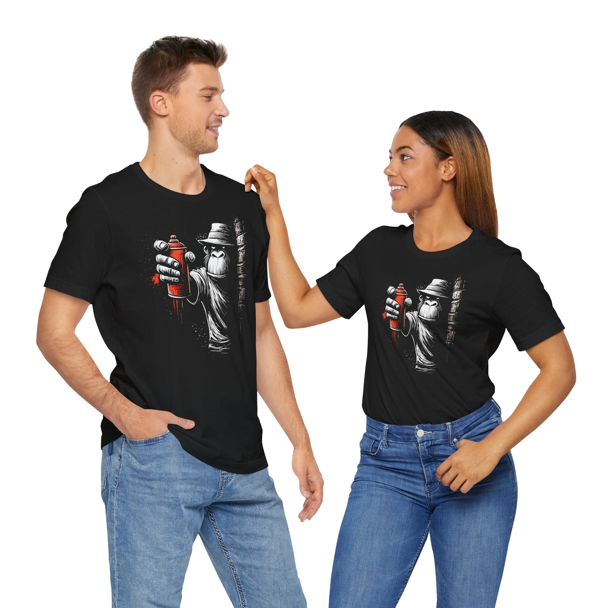 Two people wearing black t-shirts with a graphic design on a white background