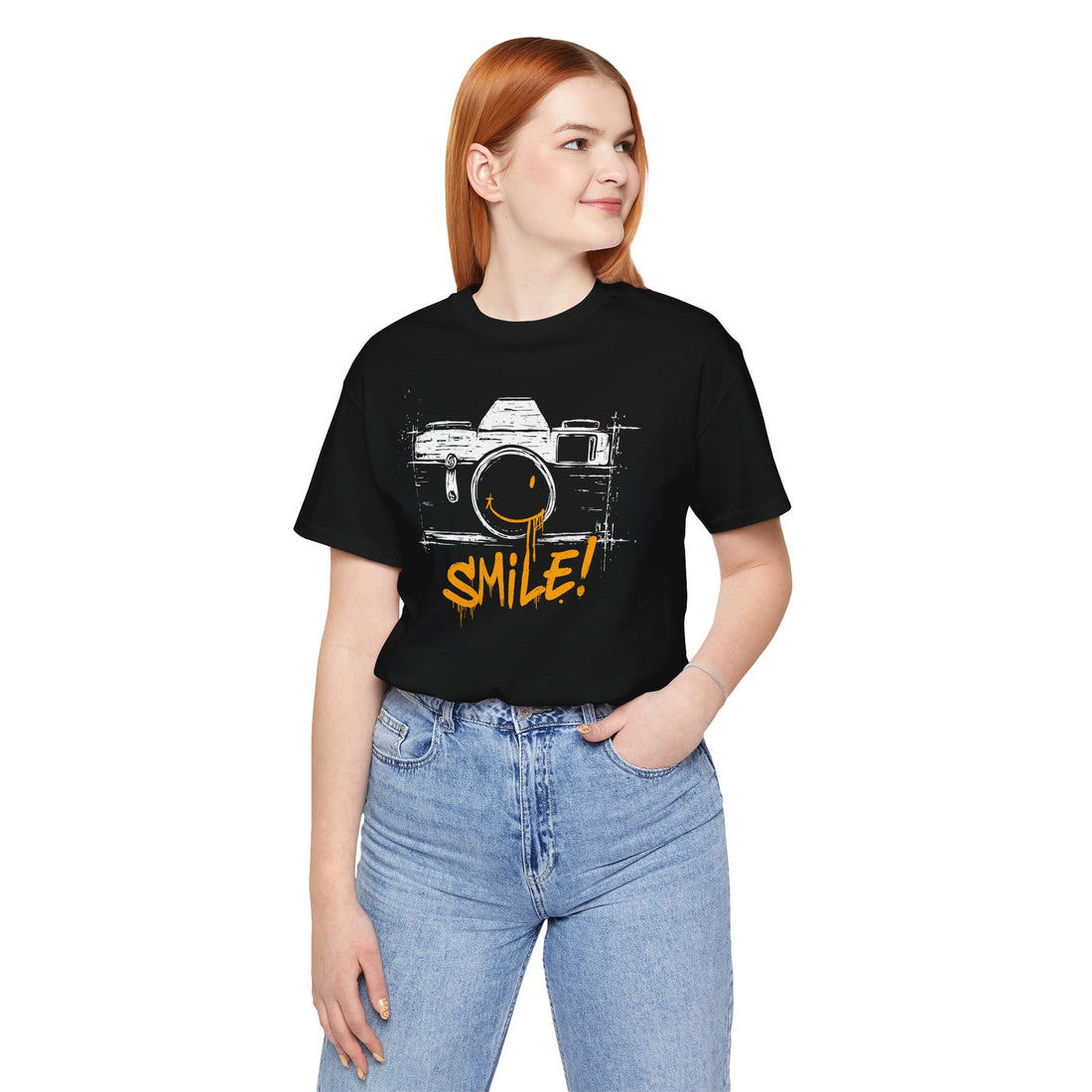 Person wearing a black t-shirt with a camera graphic and 'SMILE!' text on a white background