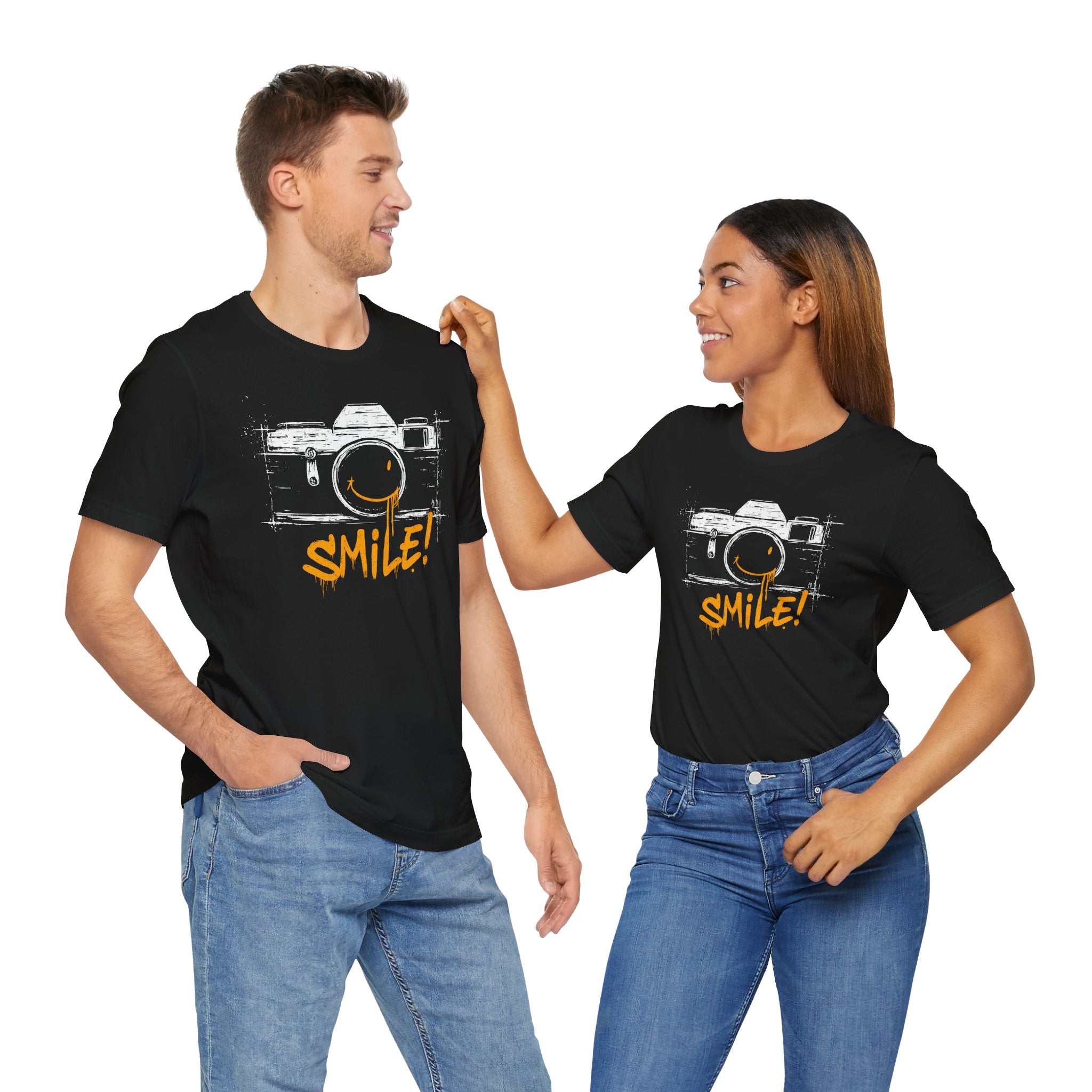 Two people wearing black t-shirts with a camera graphic and 'SMILE!' text on a white background.
