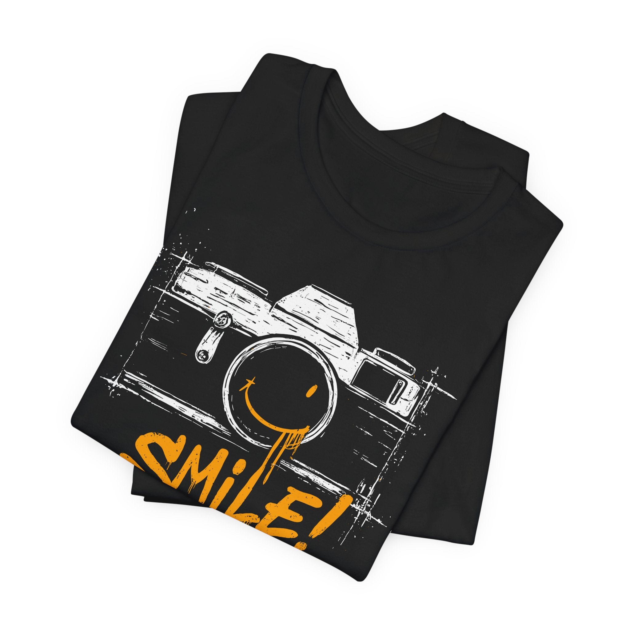 Black t-shirt with a camera graphic and 'smile!' text on a white background