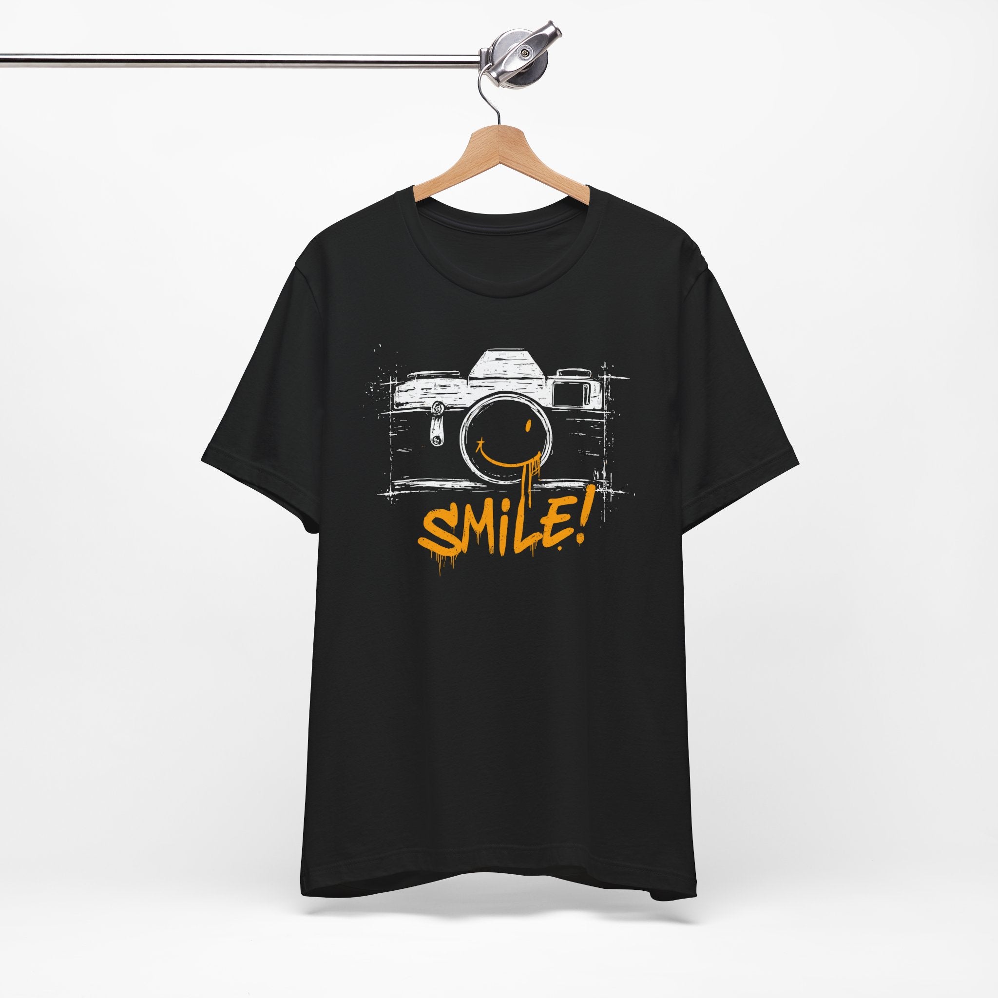 Black t-shirt with a camera graphic and 'SMILE!' text on a white background