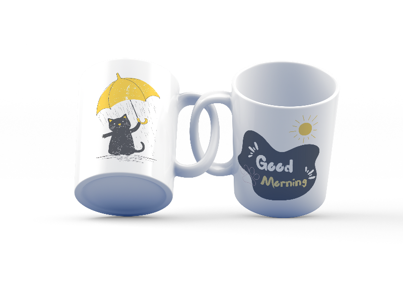 Two ceramic mugs, one with a 'Good Morning' text and paw prints, and the other featuring a black cat holding a yellow umbrella.