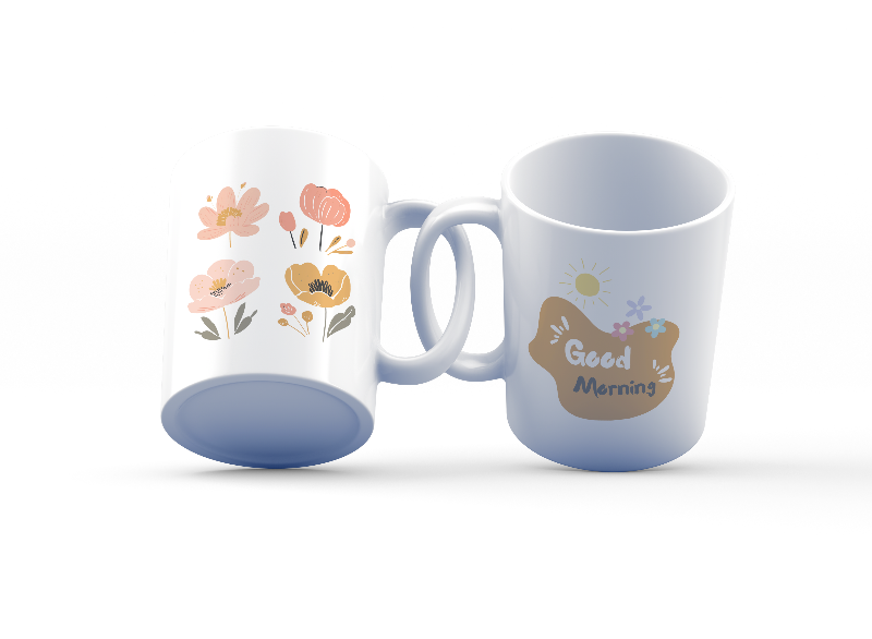 A set of two ceramic mugs, one with a floral design featuring various flowers in earthy tones and the other with a 'Good Morning' message in a golden background. Both mugs have handles and are shown with the inside of one mug facing the viewer.