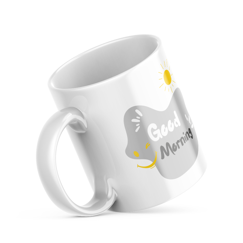 Two ceramic coffee mugs, one with a smiling face design and 'Good Morning' text, the other with a sun and 'Good Afternoon' text. Both have a white background with decorative elements.