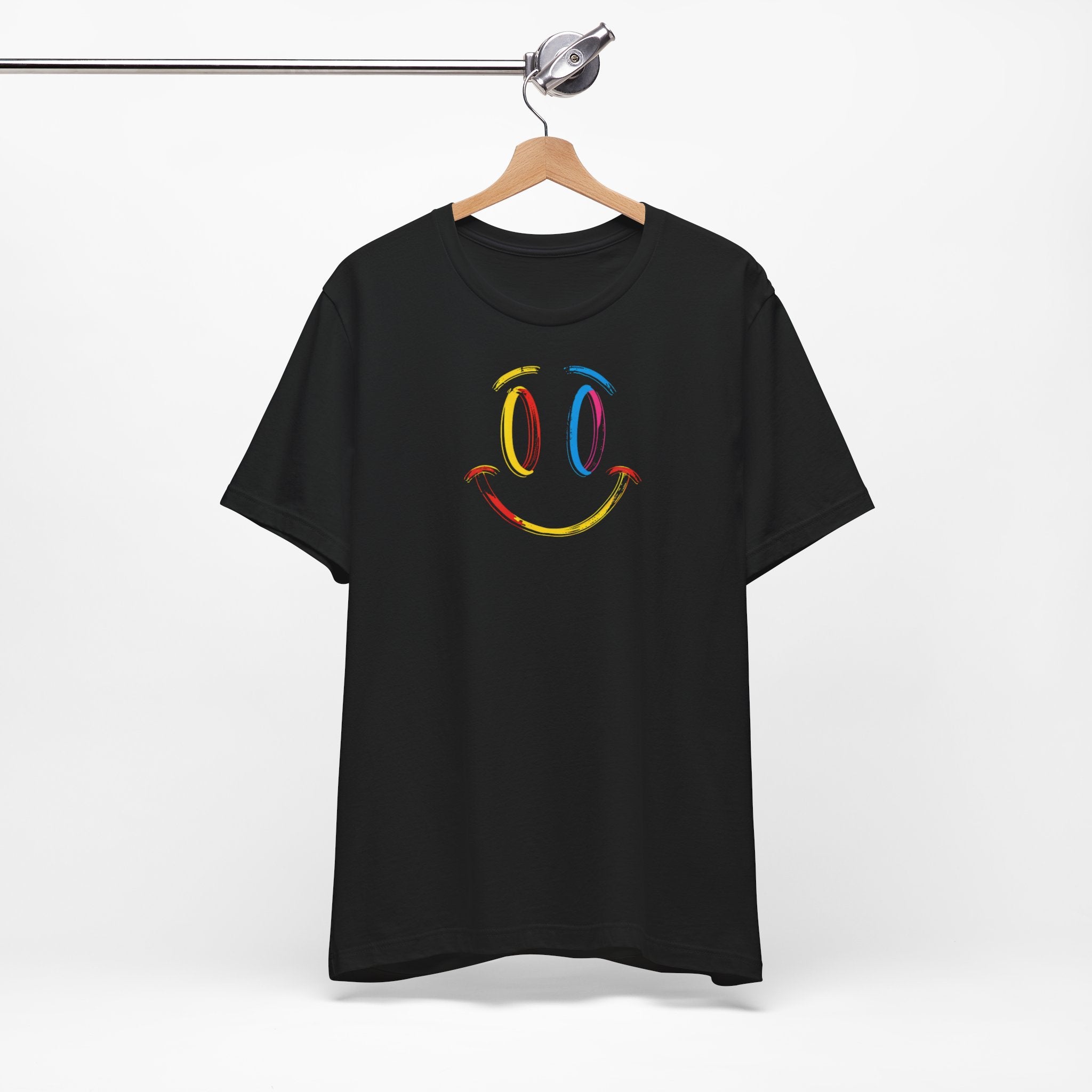 A black t-shirt with a vibrant colorful smiley face design on the front.