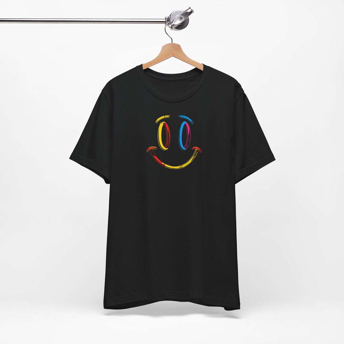 A black t-shirt with a vibrant colorful smiley face design on the front.