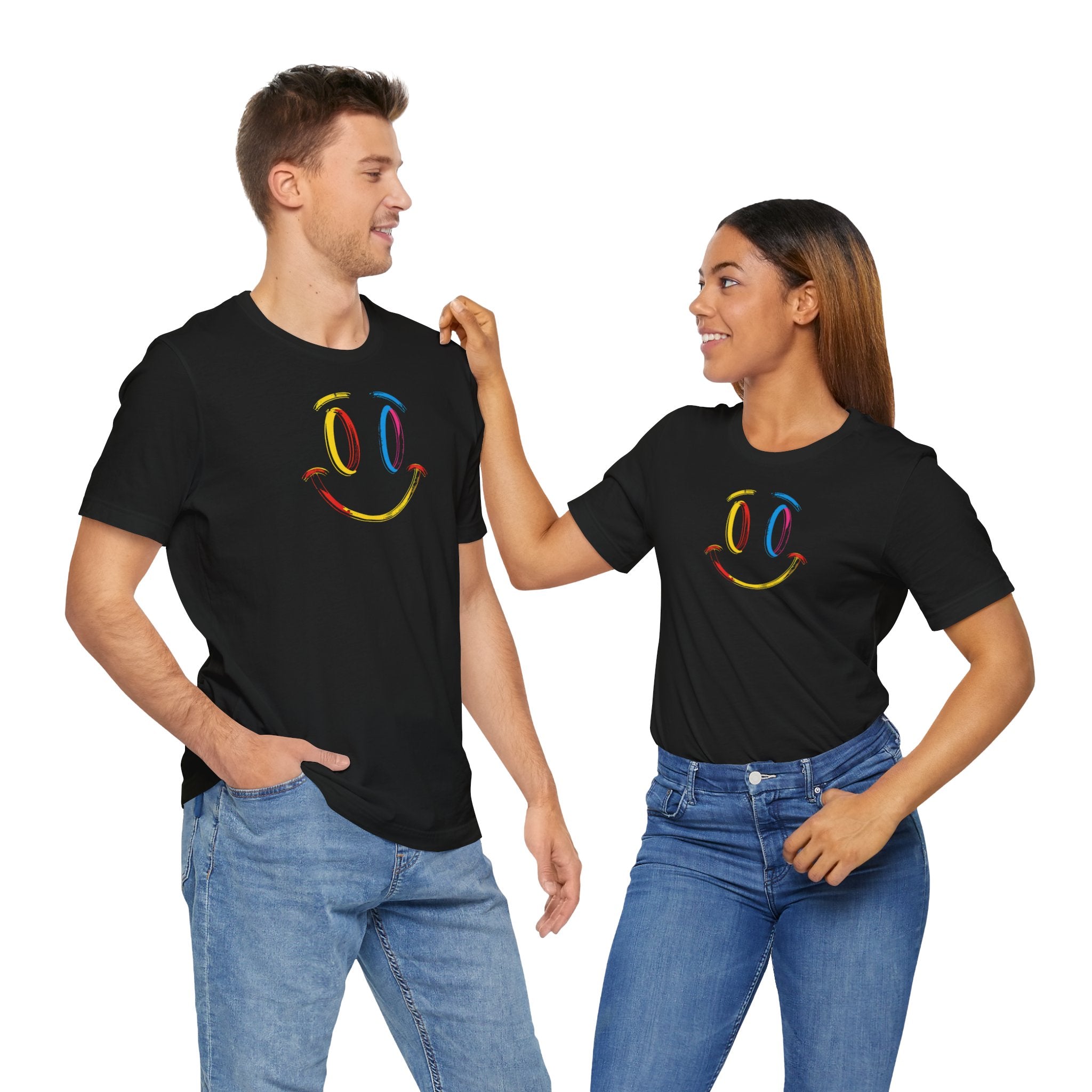 A black t-shirt with a vibrant colorful smiley face design on the front.