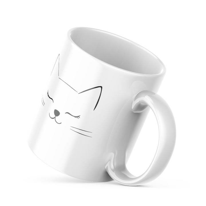 Two ceramic coffee mugs, one with a cat face illustration and 'Good Morning' text, the other with a sun design and 'Good Morning' text. Both have white interiors.