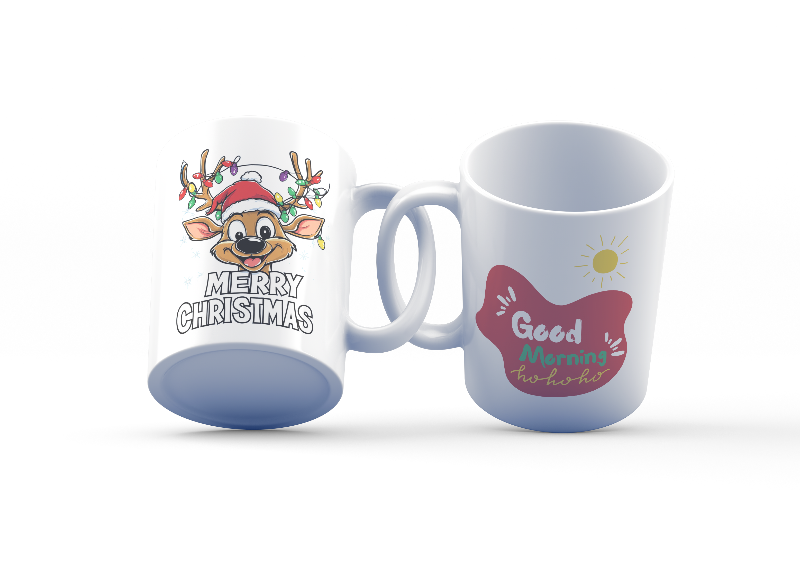 Two ceramic coffee mugs with festive Christmas designs. One mug has a reindeer with a Santa hat and 'Merry Christmas' text, and the other mug has a sun with 'Good Morning Ho Ho Ho' text.