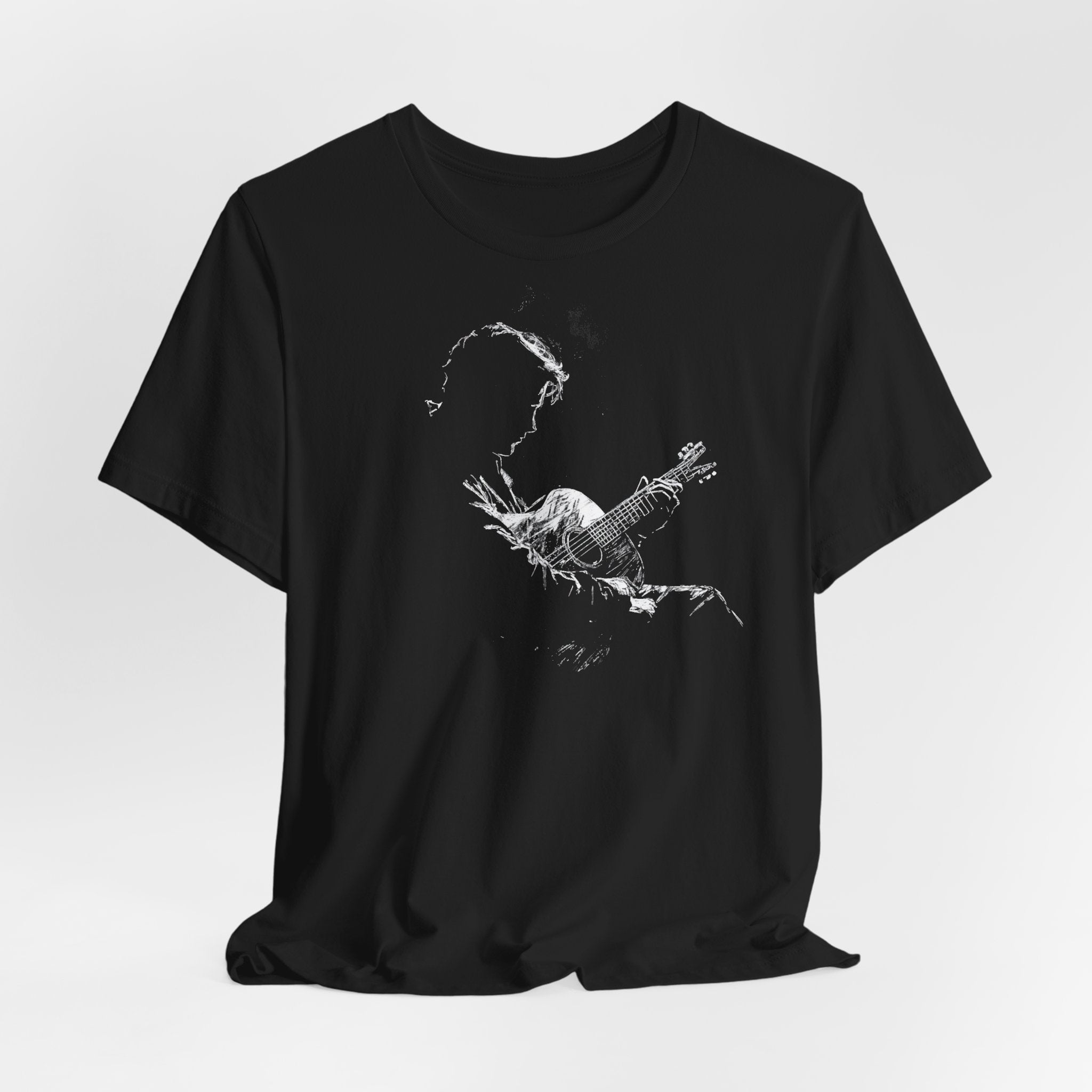 A black cotton t-shirt with a white line art depiction of a silhouette of a guitarist on the front.
