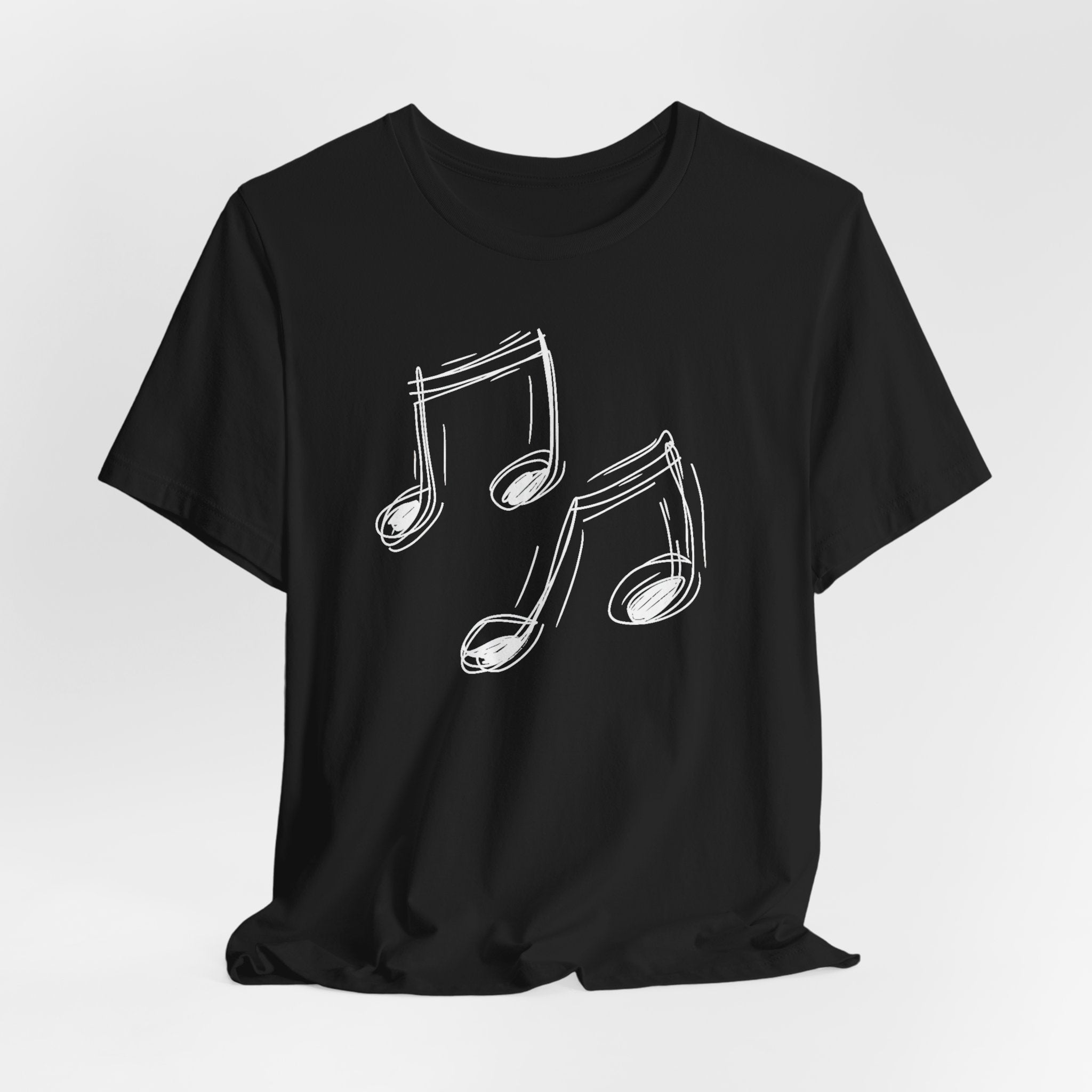 A black cotton t-shirt with a minimalist white hand-drawn music notes design on the front.