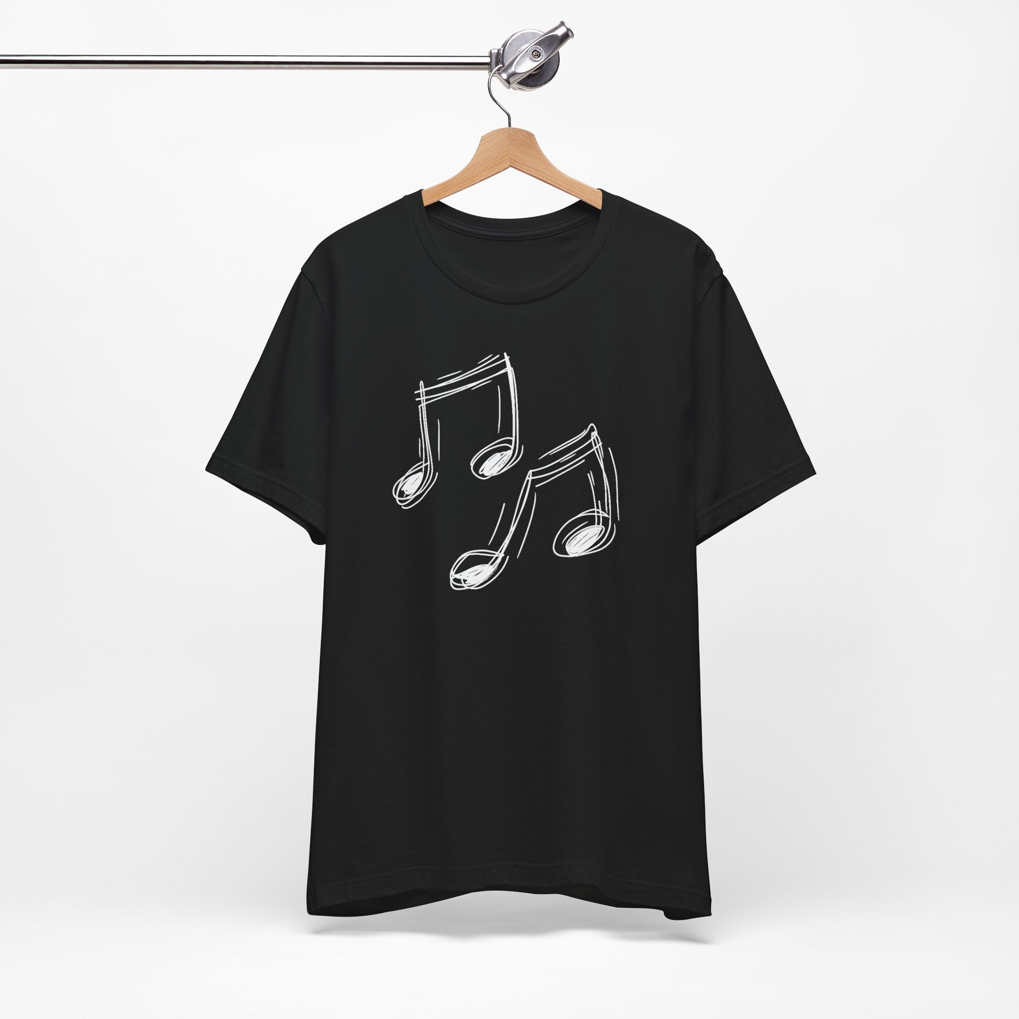 A black cotton t-shirt with a minimalist white hand-drawn music notes design on the front.