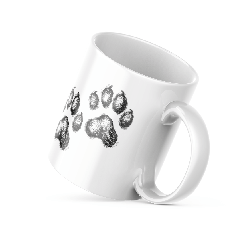 A set of two ceramic mugs, one with a black paw print design on a white background and the other with a 'Good Morning' message alongside a sun and paw accent on a blue background.