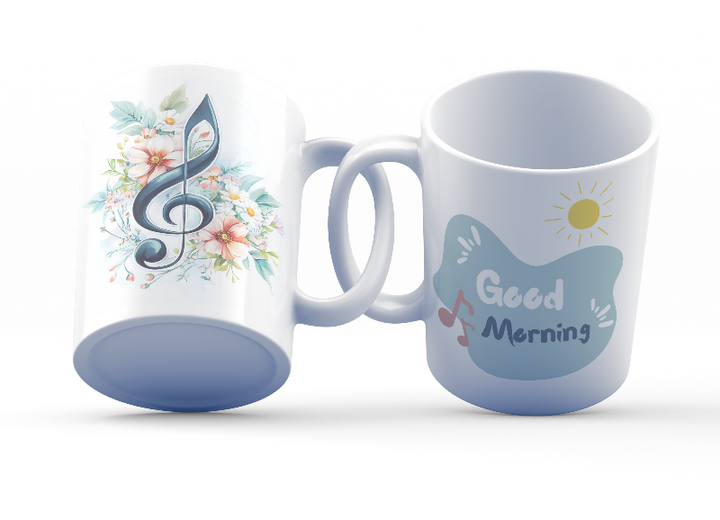 Two ceramic coffee mugs with floral and musical designs. One mug has a floral treble clef design with the text 'Good Morning' and musical notes, while the other has a simple 'Good' design with a sun motif.