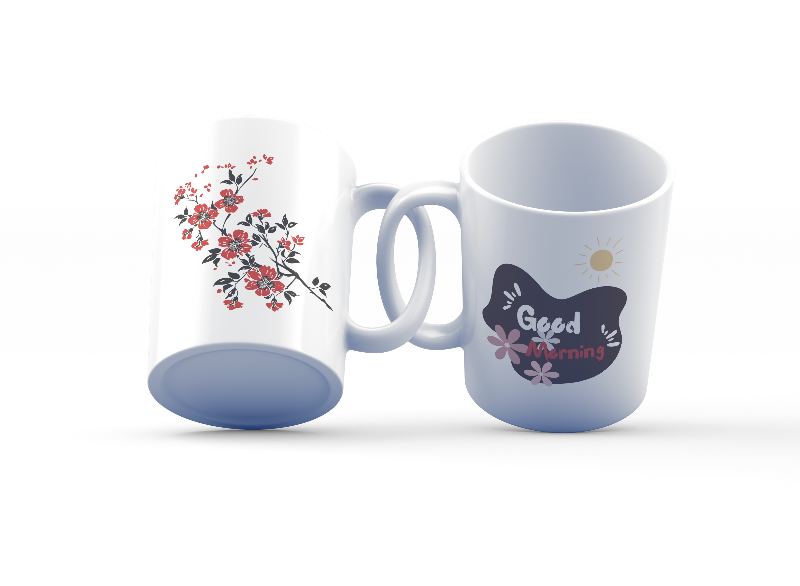 A set of two ceramic mugs, one with a 'Good Morning' text and floral design in blue, and the other with a red floral design.