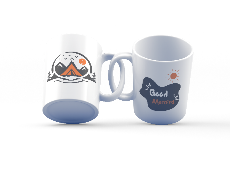 Two ceramic mugs with designs. The first mug has a mountain and tent design with a sun, and the second mug has a 'Good Morning' message with a sun symbol.