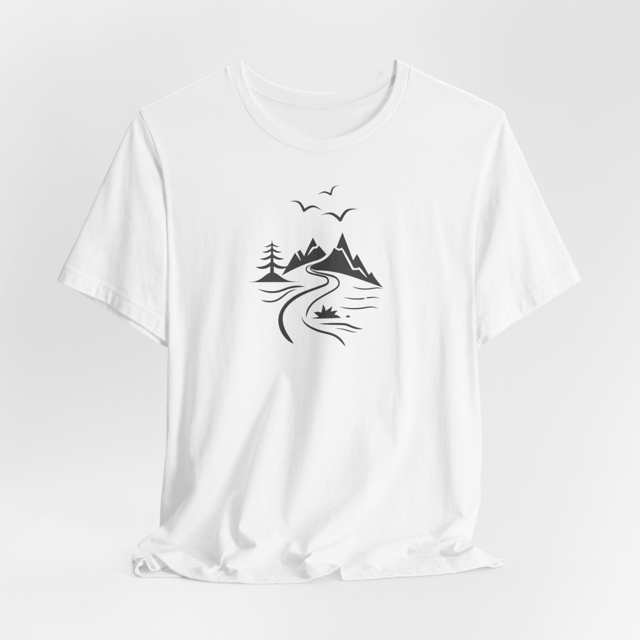 A white t-shirt featuring a minimalist black-and-white illustration of a mountain range, a river, and birds.