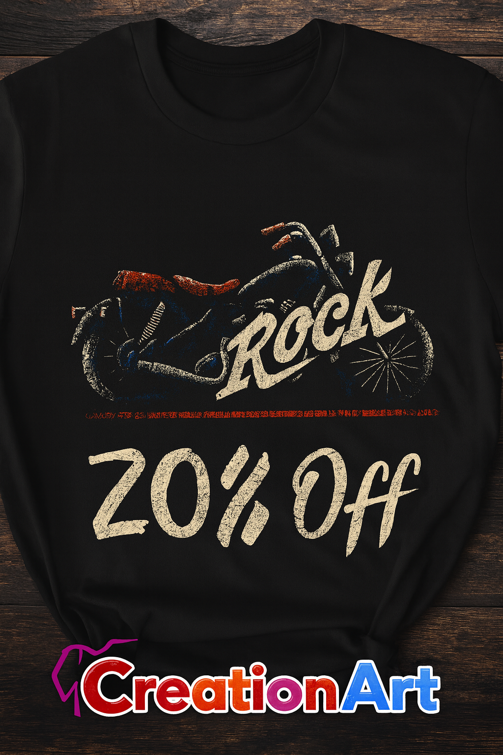 Black t-shirt with a graphic design and text on a wooden surface, featuring the brand 'Creation Art'.