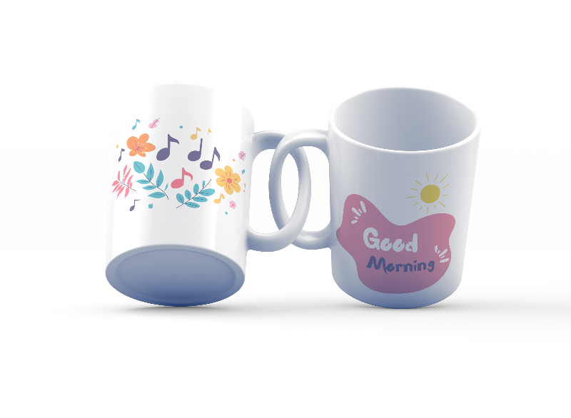 Two ceramic coffee mugs with floral and music notes designs, one with a 'Good Morning' message and the other with a sun and clouds design.