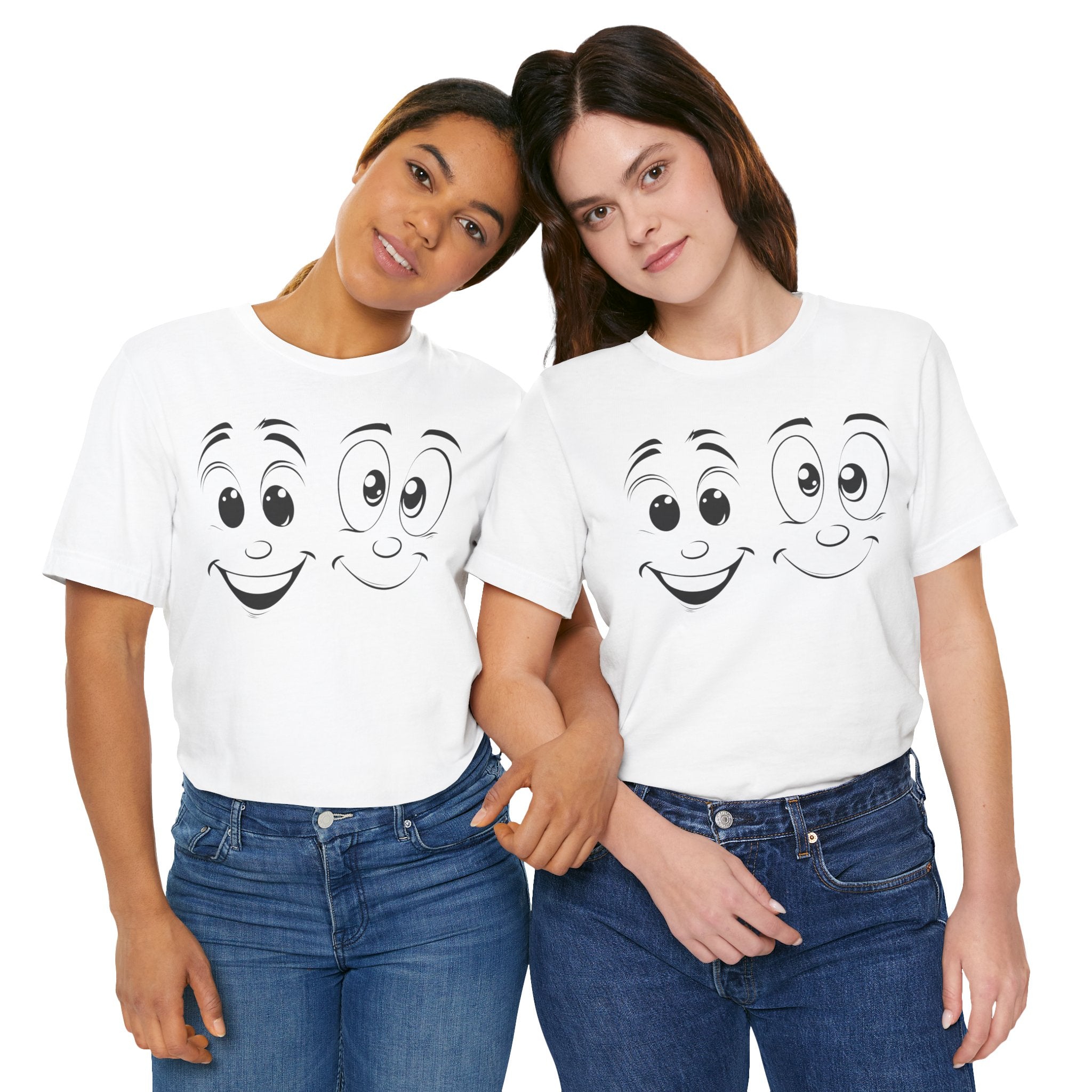 A white cotton tee with a graphic print of two cartoon faces with smiles on it.