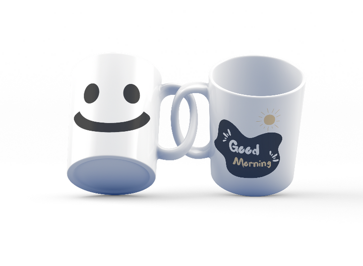 Two ceramic mugs, one with a minimalist smiley face design and the other with 'Good Morning' text and a sun graphic, both in black and yellow colors on a white background.