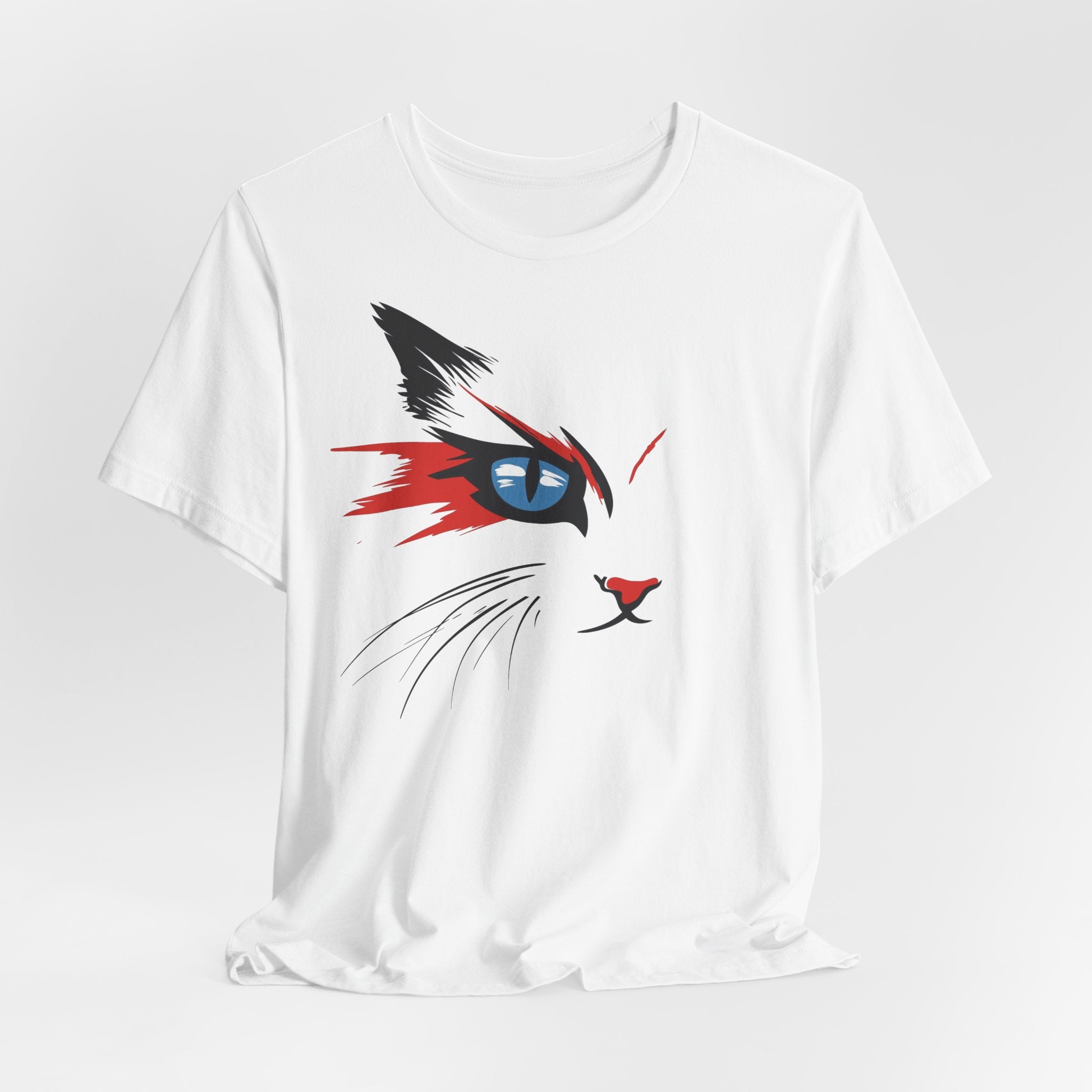 White cotton tee with a bold and artistic design of a cat's face featuring vibrant red, black, and blue colors.