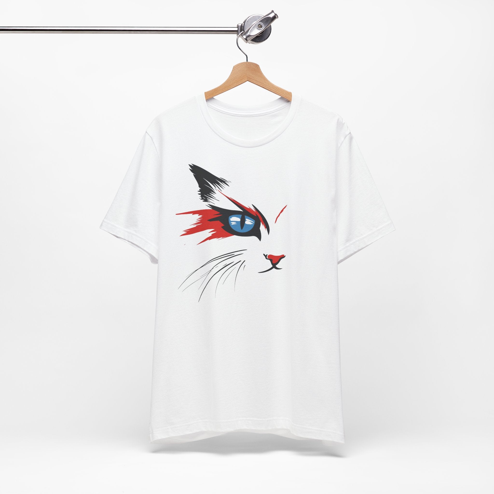 White cotton tee with a bold and artistic design of a cat's face featuring vibrant red, black, and blue colors.