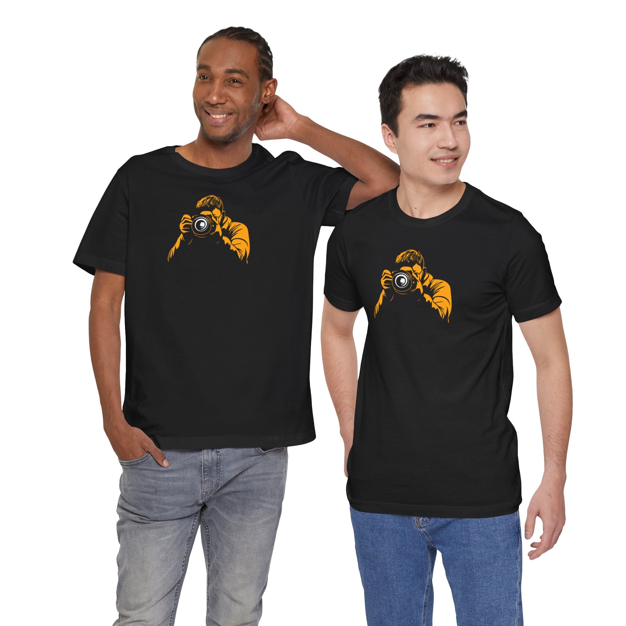 A black crew neck t-shirt with a bold yellow graphic of a photographer holding a camera.