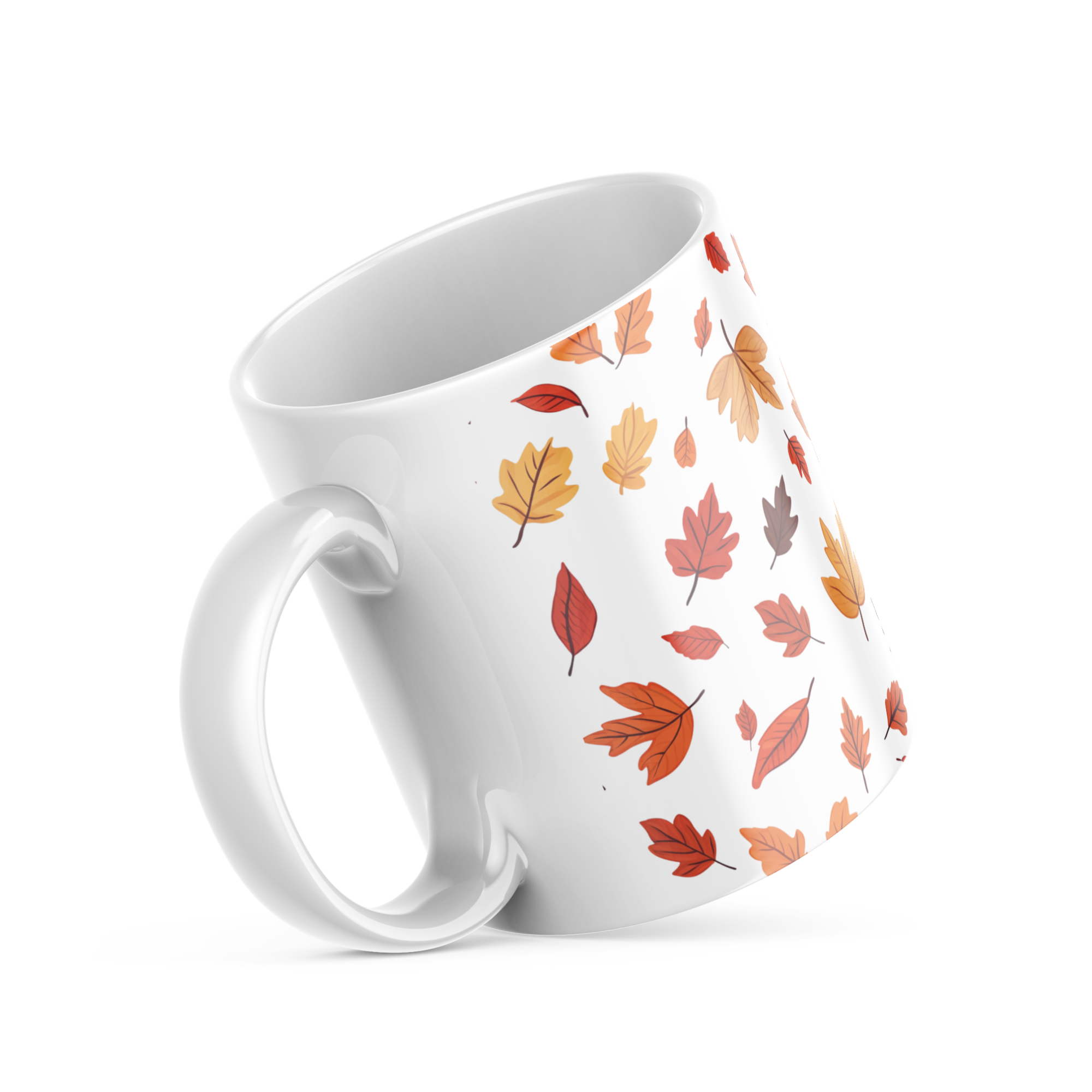 Handle detail, glossy ceramic mug with fall leaf design
