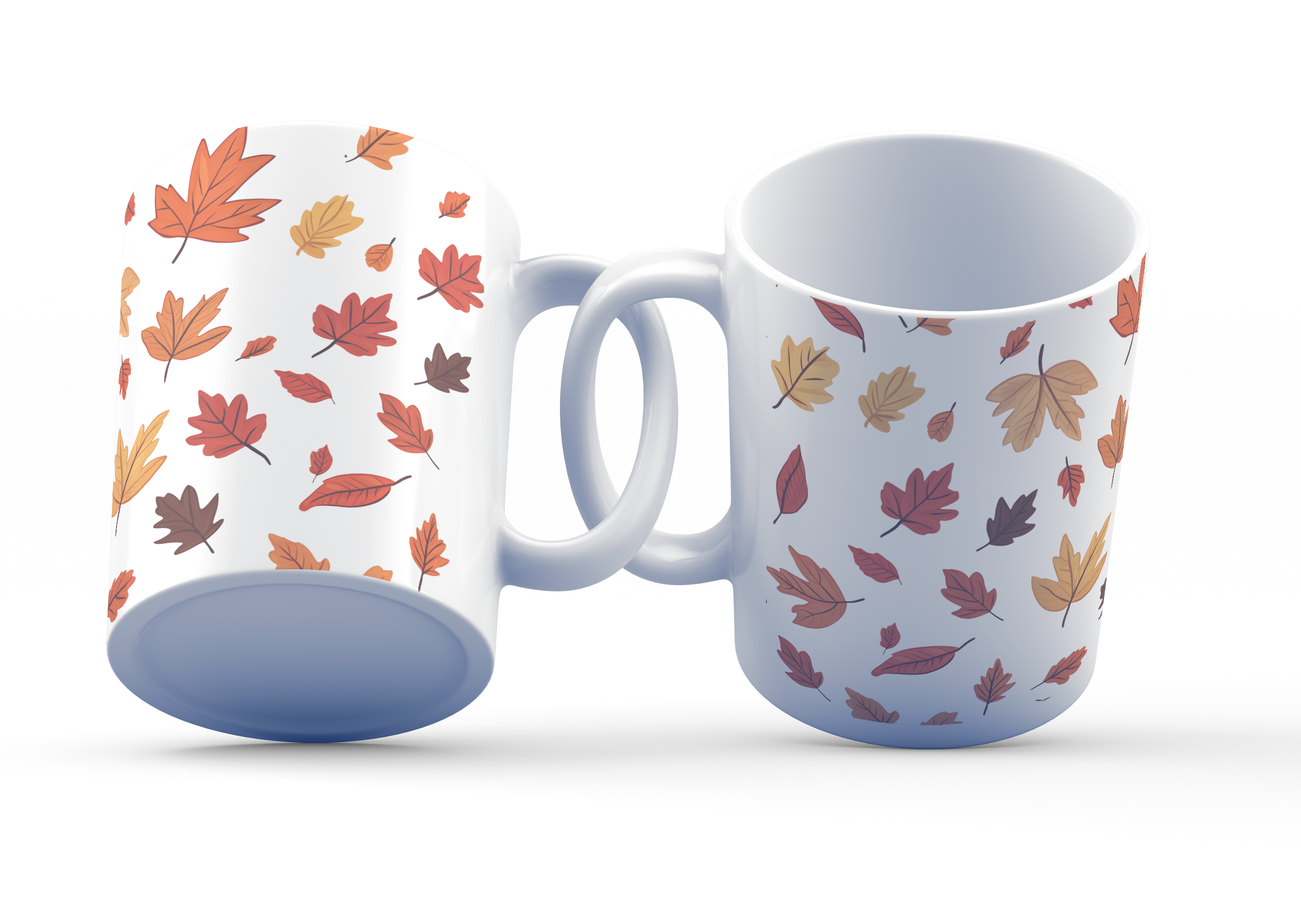 A white ceramic coffee cup with a pattern of autumn leaves in shades of orange, red, yellow, and brown on both sides.
