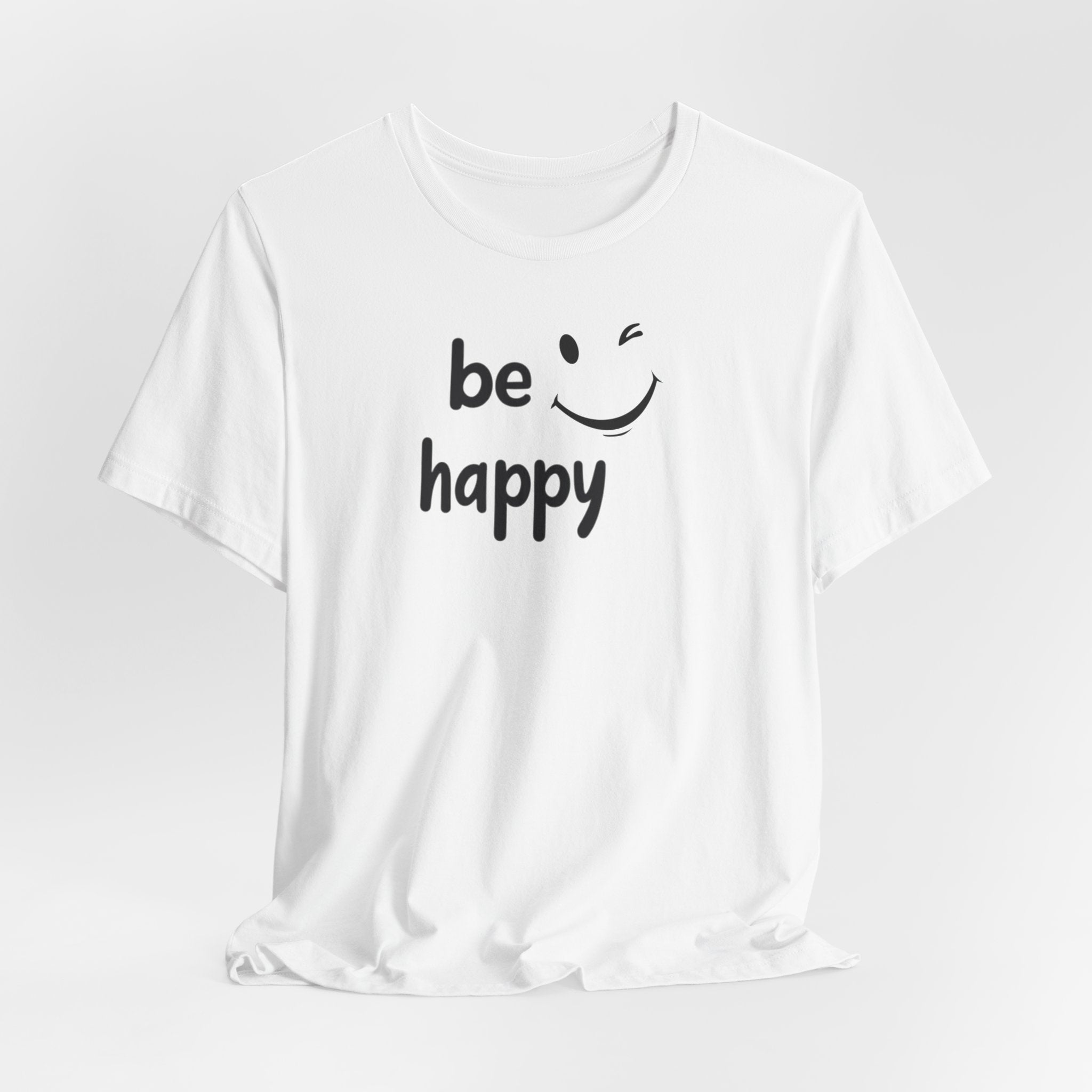 A black crew neck t-shirt with the text 'BE HAPPY' and a smiley face design on the front.