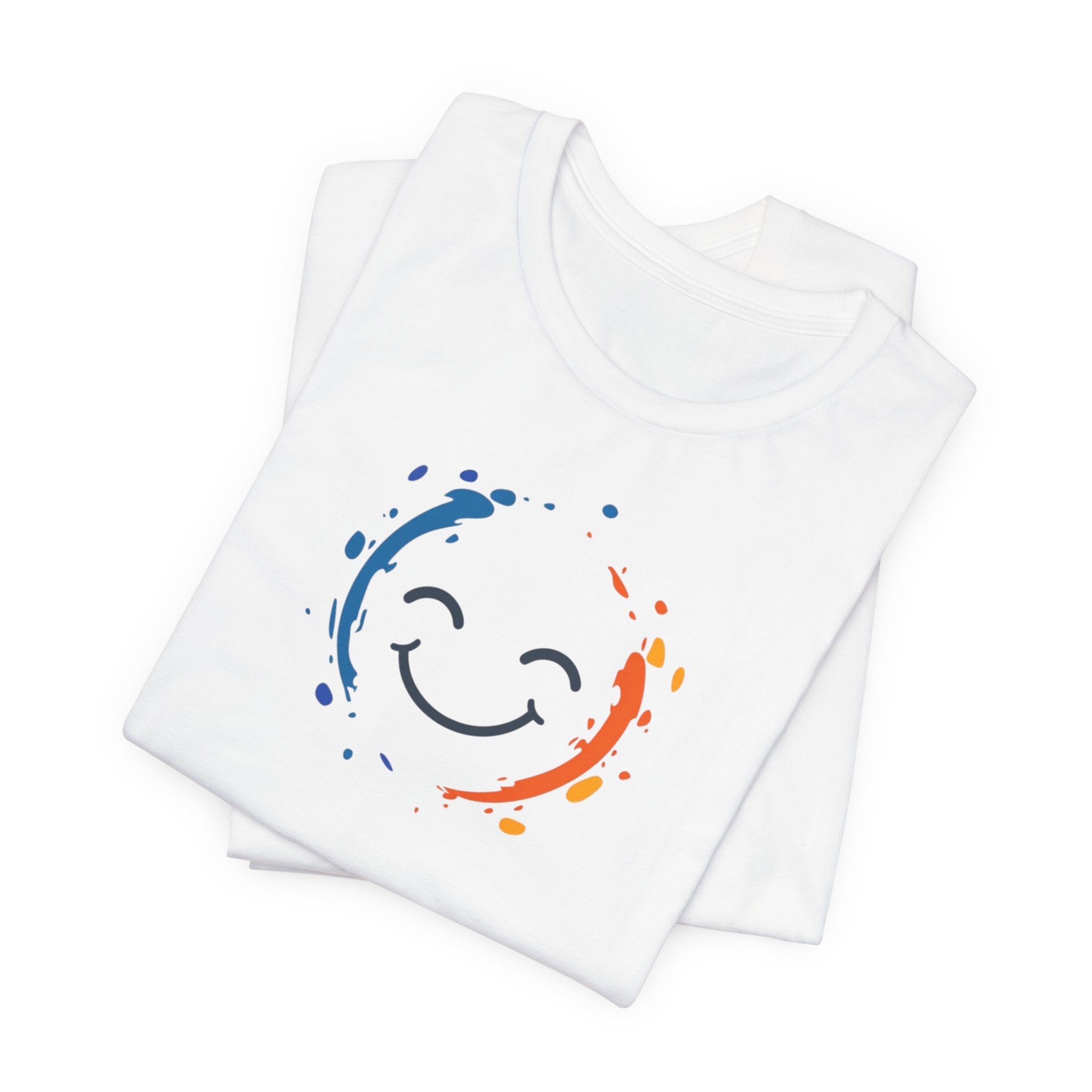 White cotton tee with a vibrant happy face design and color splashes in blue and orange.