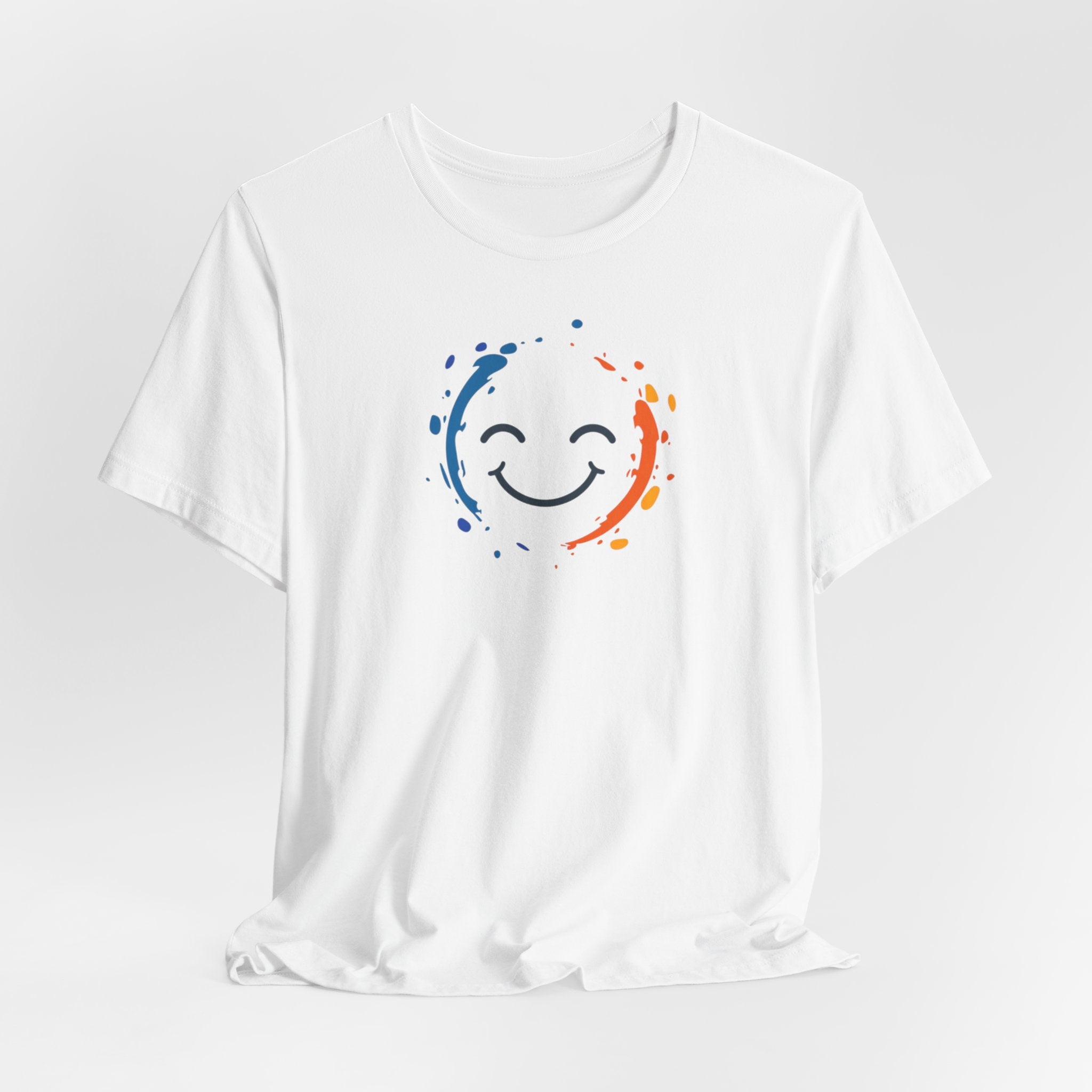 White cotton tee with a vibrant happy face design and color splashes in blue and orange.
