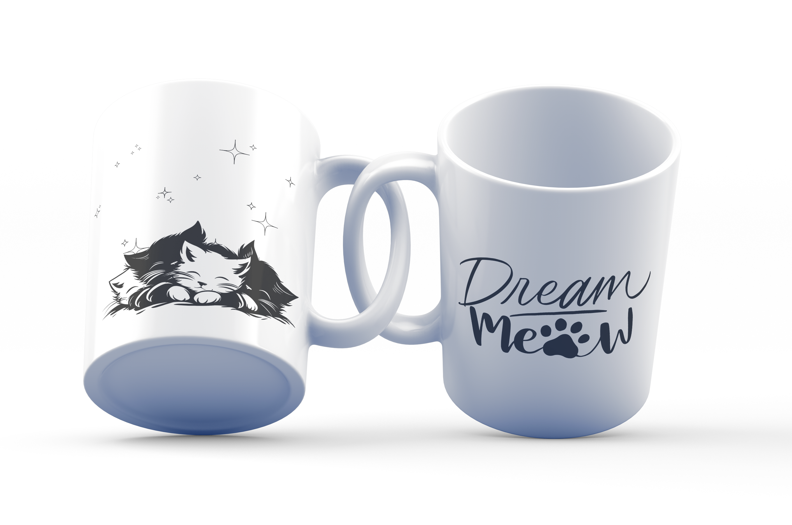 White ceramic mug with a sleeping black kitten illustration and the text 'Dream Meow' accompanied by a paw print design.