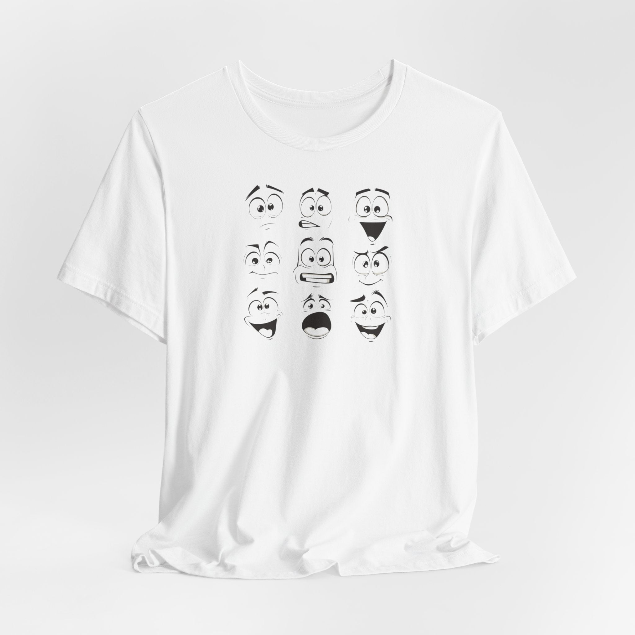A white cotton unisex t-shirt featuring a design of various expressive cartoon faces.