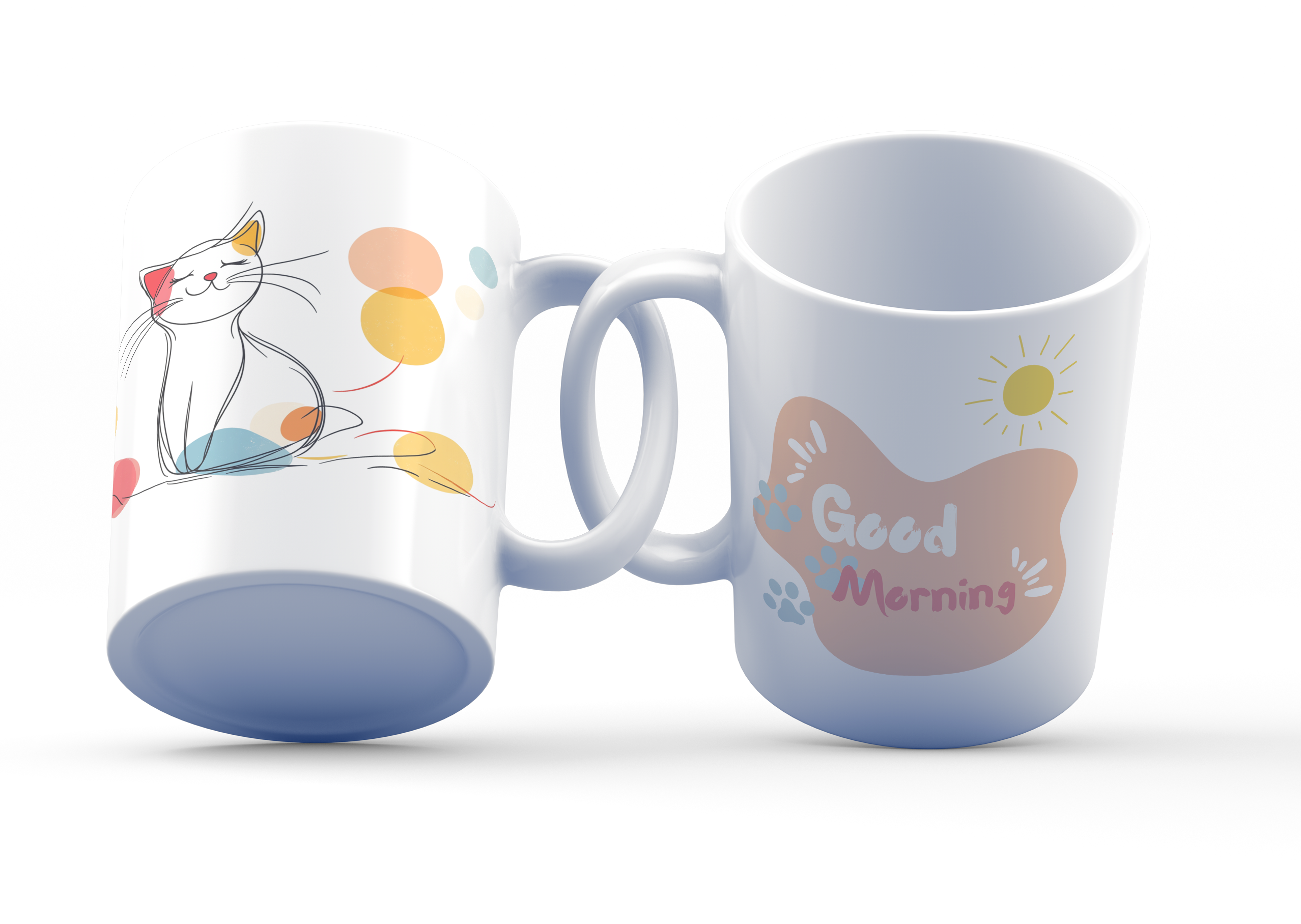 Two white ceramic mugs, one with a colorful cat illustration and dots design, and the other with a 'Good Morning' message featuring a sun and paw prints.