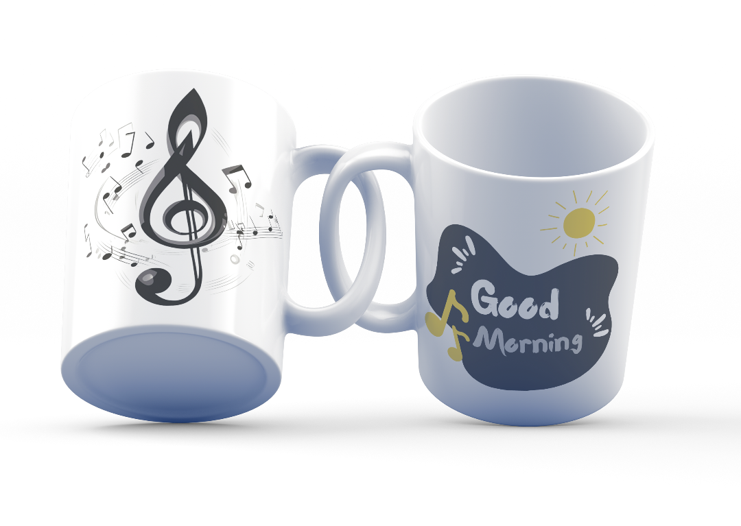 Two white ceramic mugs, one with a treble clef and musical notes design, and the other with a 'Good Morning' message featuring a sun and musical notes.