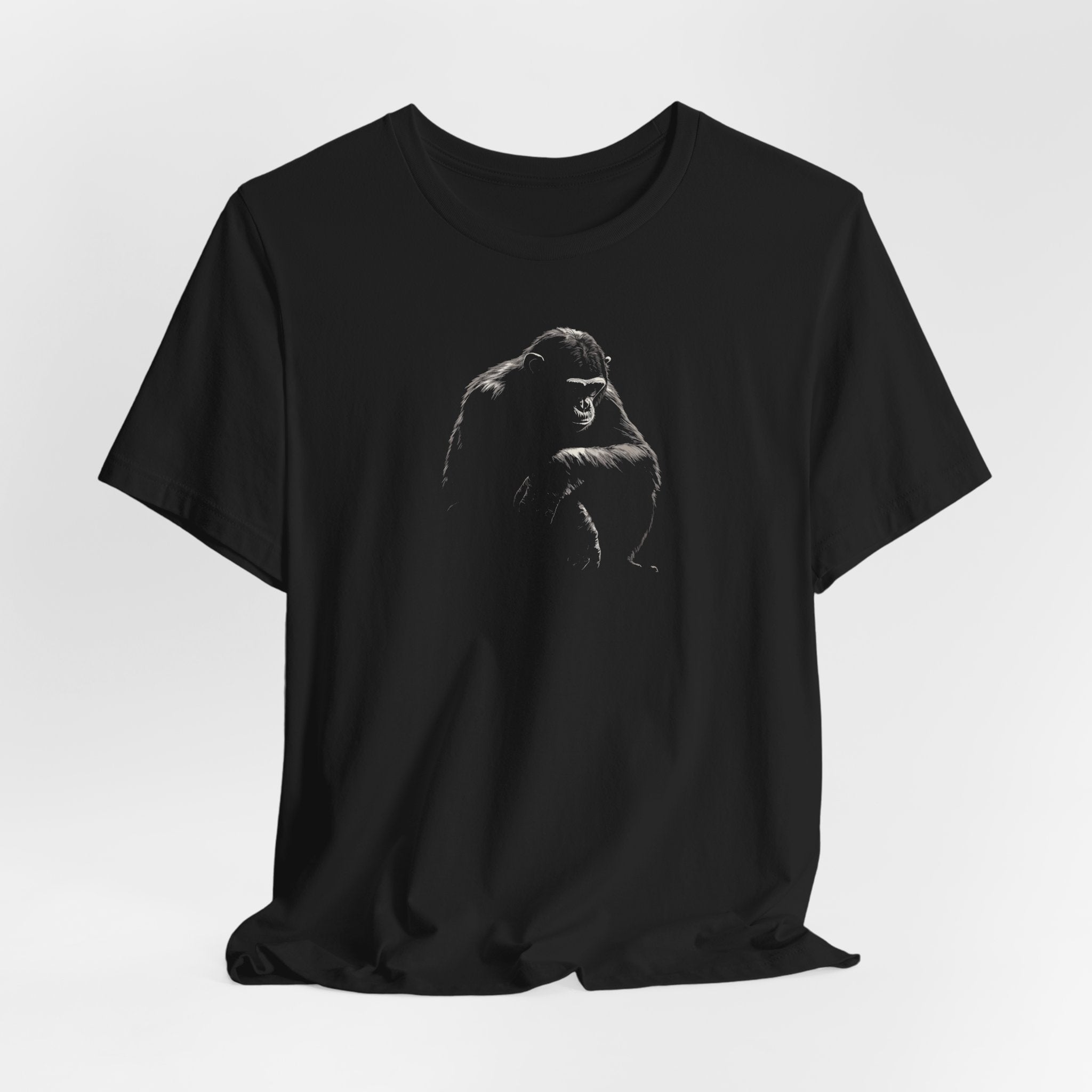 Black cotton t-shirt with a bold monochrome illustration of a gorilla in a kneeling position on the front.